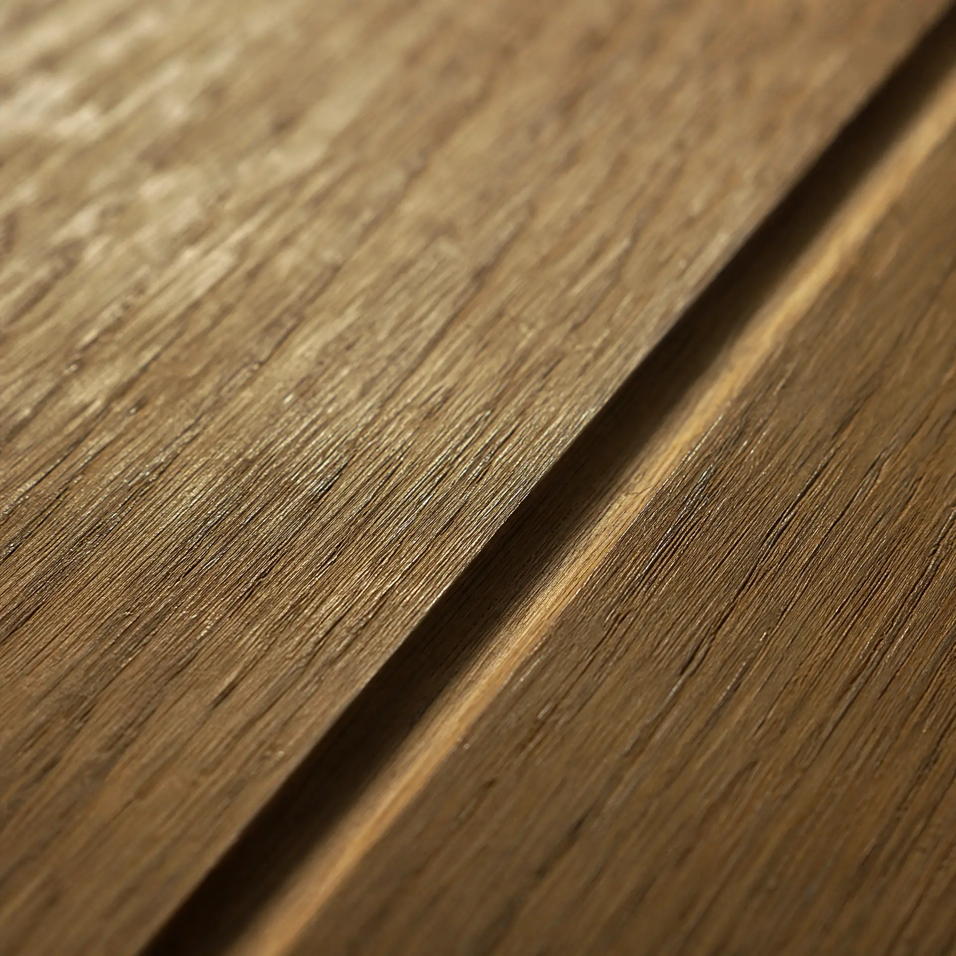 Oiled solid oak board, open grain, a routed groove running across the surface